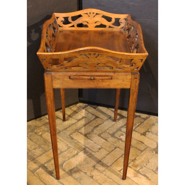 Late 19th century Country French tea table with candleslides. Solid, pierced & carved scrolling leaves shaped gallery top....