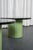 Set of 2 coffee tables composed of a central barrel upholstered in matcha green leather and a thick smoked acrylic glass...