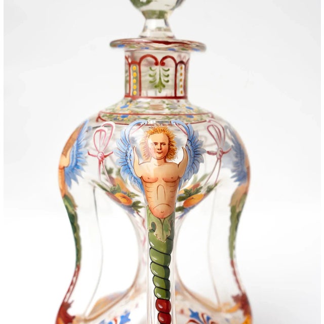 ANTIQUE AUSTRIAN DECANTER AND CORDIAL GLASSES Hand-blown pinched clear glass decanter and four matching cordial glasses....