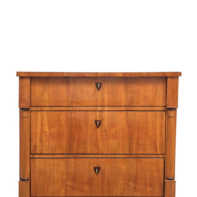 Chest of drawers Biedermeier, circa 1820, Germany, cherry wood, three drawers with baluster half-columns, inlaid...