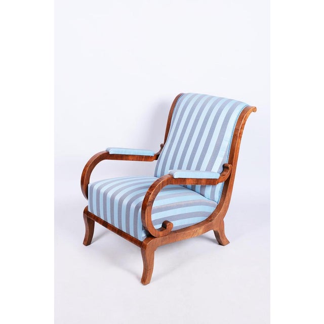 This armchair is a truly magnificent and refined showcase of high-end bourgeois furniture from the early Biedermeier...
