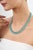 This statement necklace features 47.9 carats of pear-cut cabochon turquoise and emeralds, set in 14k white gold. Each...
