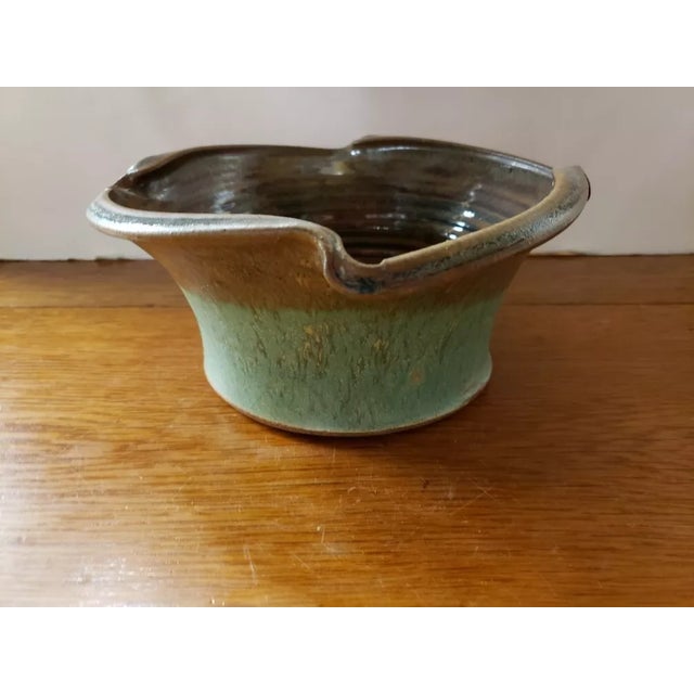 This is a 2015 Signed Green and Brown Pottery Bowl with Glazed Inner Surface. It measures 3 5/8" high and 8“ in diameter....