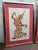 Pair of vintage Thai temple rubbings. Red ink on rice paper. Professionally framed in gold metal frames with red mats....