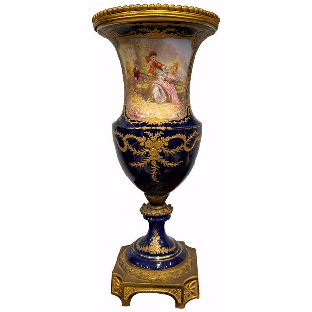 excellent pair of vases, of french origin, made of porcelain and mercury-gilt bronze, both vases feature the "sevres"...
