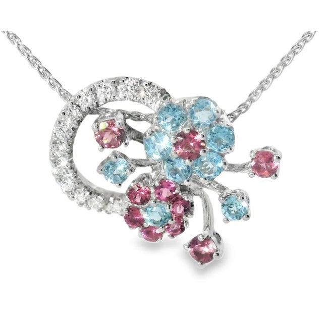 Add elegance and color to your collection with this exquisite 18K white gold necklace , featuring 12 brilliant round...