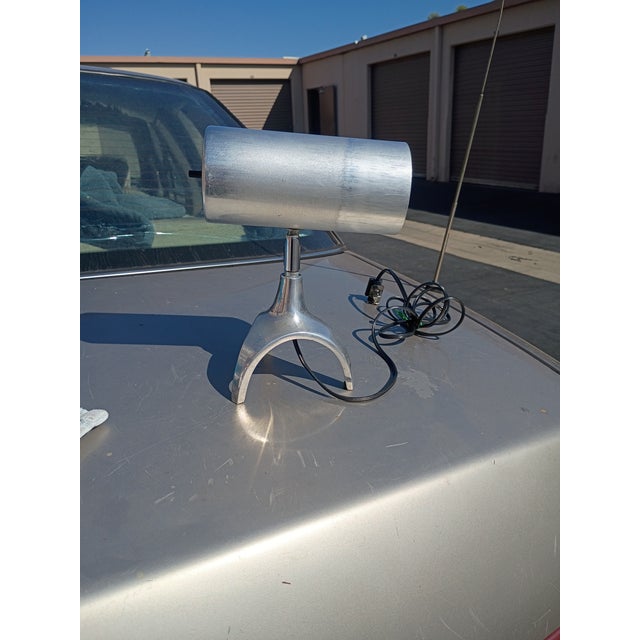 this is a solid aluminum desk lamp with articulating shade it also serves as a fine task lamp its custom made and can be...