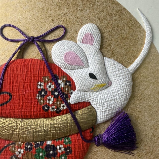 This refined Japanese shishigiyo depicts two playfully rendered mice playing together with a temari ball, a traditional...