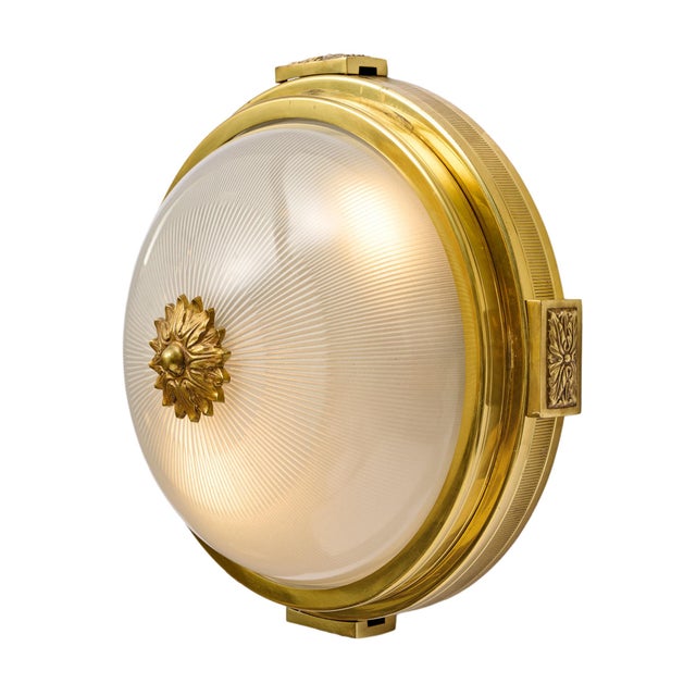 Pair of ceiling mounts from the Art Deco period in France. These fixtures have a round bronze structure and central finely...