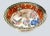 A gorgeous, hand painted Chinese bowl from the mid 20th century with vibrant colors, birds in pinks, greens and orange....