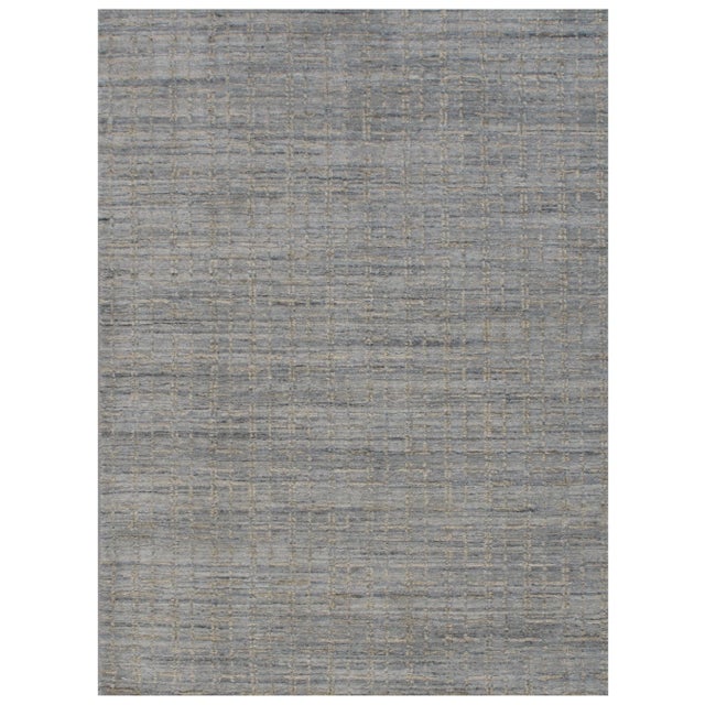 Crafted from a blend of wool and viscose, this contemporary rug boasts a luxurious firm mid-height pile, offering both...