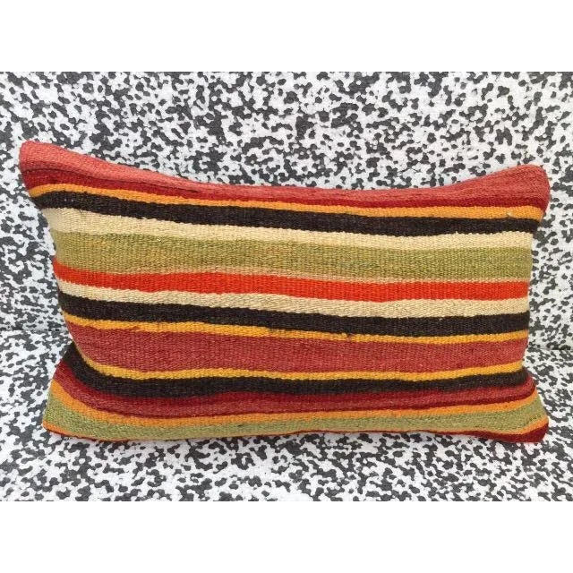 This Turkish pillow cover measures 10" x 20" and is made from the highest quality vintage Kilim in 100% wool on the front....