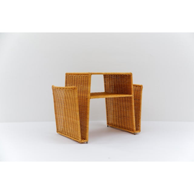 Lovely Italian rattan side table / magazine rack, 1970s, Italy. There is a slightly lighter spot on the top surface, as...