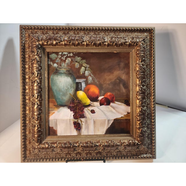 Lovely still life painting of fruit with grapes dripping over the edge of the table cloth. Impressionistic with bold...