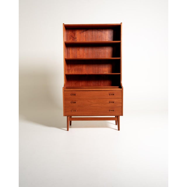 Teak bookcase with adjustable shelves, three large drawers, and a pull-out writing surface. Johannes Sorth for Bornholms...