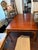 This antique dining table is a stunning piece of furniture that will add a touch of elegance to any room. Crafted from...