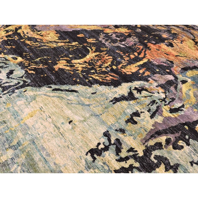 This rug features an abstract design attributed to the color palette and composition of Volcan fosforescente, a 1969...