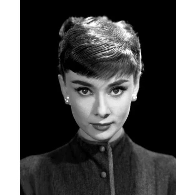 Audrey Hepburn "Roman Holiday" Audrey Hepburn in a classic black and white headshot from the 1953 film "Roman Holiday"....