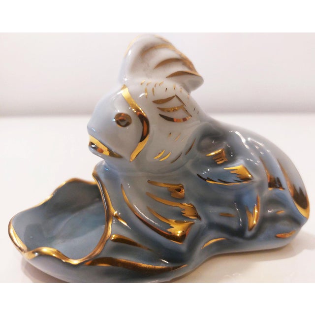Limoges French porcelain fish figurine, circa 1930, hand-painted, in excellent, mint condition. It features gold leaf...