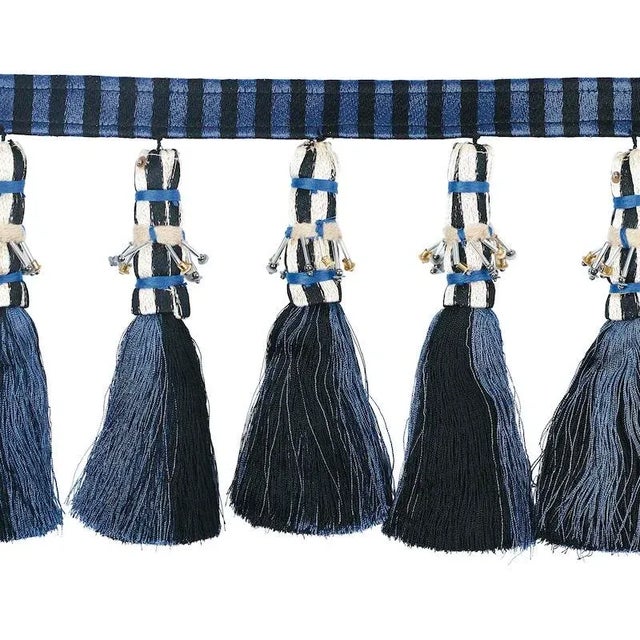 A colorful, handcrafted trim that is totally over the top, this design incorporates silky, striped tassels and elegant...