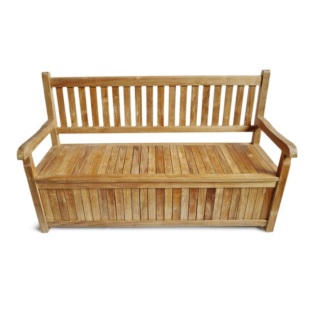Classic outdoor teak wood bench with arms and slatted back. Seat lifts up to reveal spacious trunk storage area. Each may...