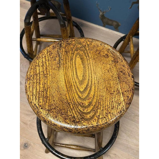 Set of 3 industrial stools which are adjustable in height. Combination of oak, cast iron and iron. Beautiful weathered...