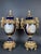 19th Century French Sèvres-style porcelain and gilt bronze mounted urns The urns have cobalt blue porcelain bodies,...