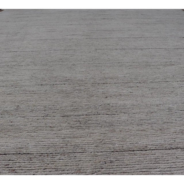 Afghanistan made, Minimalist Modern with Solid Off White Background hand knotted rug in Textured fine Wool. As part of our...