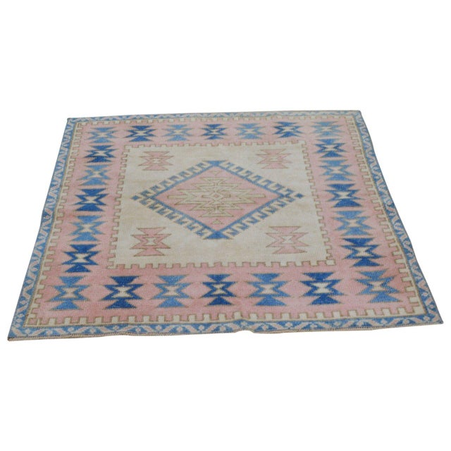 Hand-knotted with care using traditional rug-making techniques, this wool rug blends timeless craftsmanship with a modern...