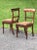 This exquisite pair of Regency "Klismos" chairs crafted from rich walnut exudes timeless elegance and sophistication. The...