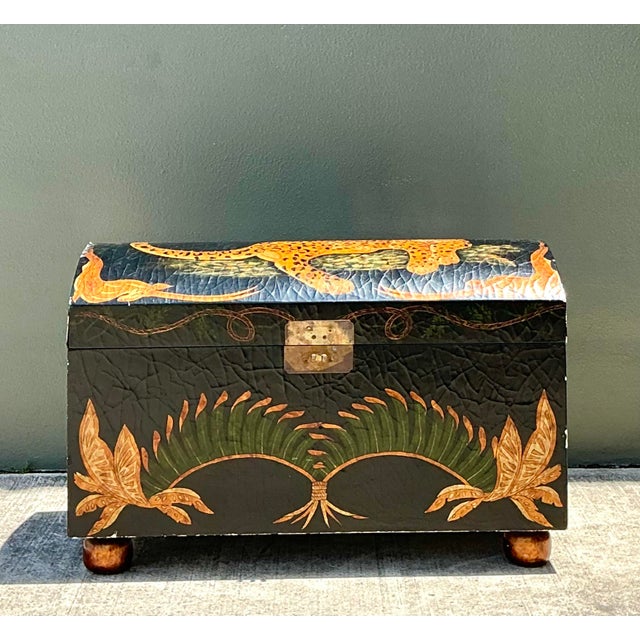 This extraordinary dome-top trunk is a masterclass in Safari Chic aesthetic, featuring a dramatic crackle-lacquered finish...