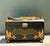This extraordinary dome-top trunk is a masterclass in Safari Chic aesthetic, featuring a dramatic crackle-lacquered finish...