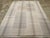 This mid-20th century Turkish Flatweave Kilim rug, features a softly muted palette and a subtle interplay of vertical and...
