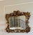 Exceptional antique Italian Florentine giltwood mirror, hand-carved in the Baroque Revival / Rococo style typical of late...