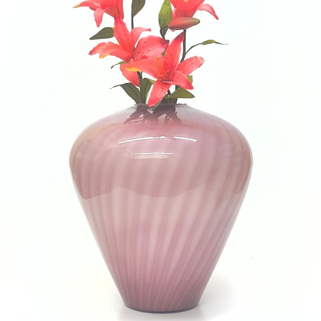 This is a stunning mauve-purple swirl design, cased-glass, oversized vase. This handblown piece is attributed to Murano....