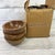Add refined, rustic character to your tablescape with this set of three Teigen wood and rivet snact bowls. Made of acacia...