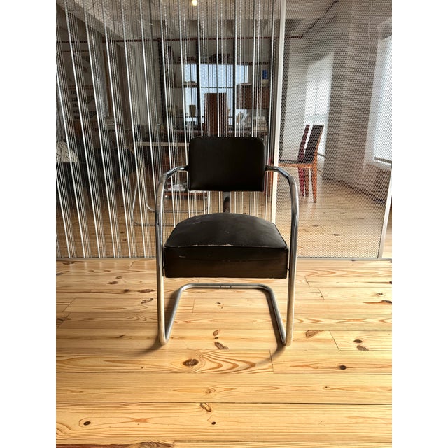 Set of two American Art Deco chrome cantilever chairs, showcasing the sleek lines and bold materials associated with early...