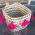 This cute little basket is hand-woven by local artisans and the tassels are handmade and applied by a women's cooperative...