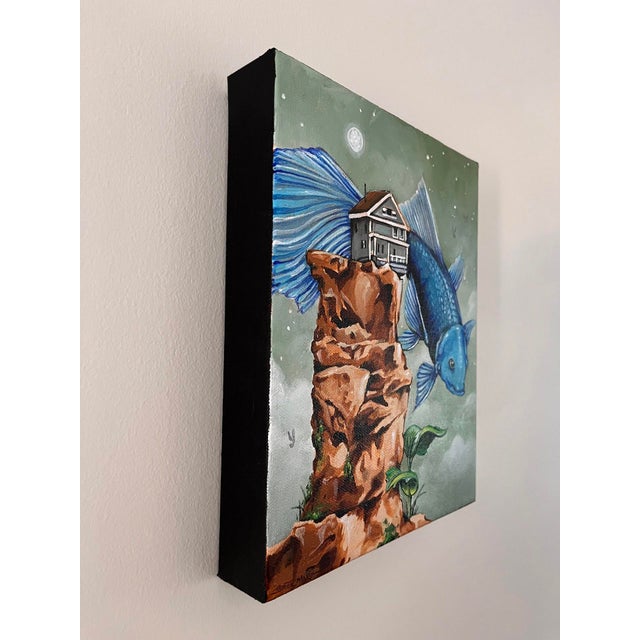 Surrealism Just Outside by Patrick Maxcy | Acrylic on canvas Fish with a house flying over a rocky landscape. For Sale - Image 3 of 3