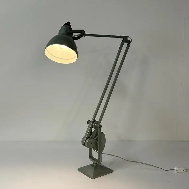 Industrial ERPE Desk Lamp with Counterweight, 1940s/50s. This metallic green desk lamp can rotate 360 degrees and is fully...