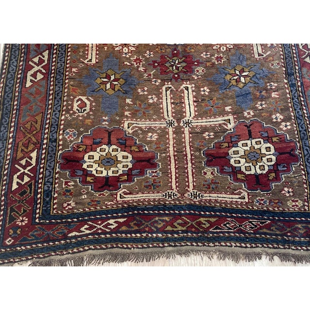 An authentic late 19th-century masterpiece of Caucasian weaving, this antique Kuba rug (circa 1880s) showcases the...