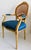 This French Louis XVI Style Fauteuil Chair features a beautiful giltwood frame with intricate carvings, complemented by a...