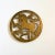 A beautiful circular brass trivet with the design of a unicorn. Perfect for keeping hot plates off of surfaces.