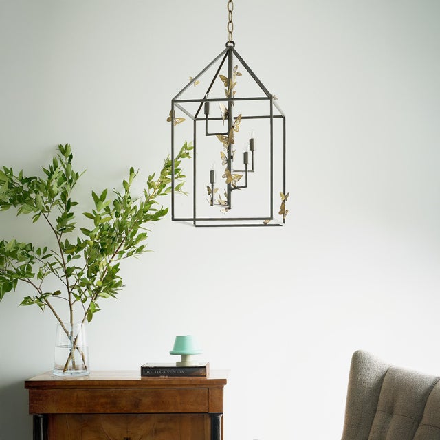 Embellished with whimsical butterflies in a captivating arrangement, the Monarch Lantern brings a touch of charm to any...