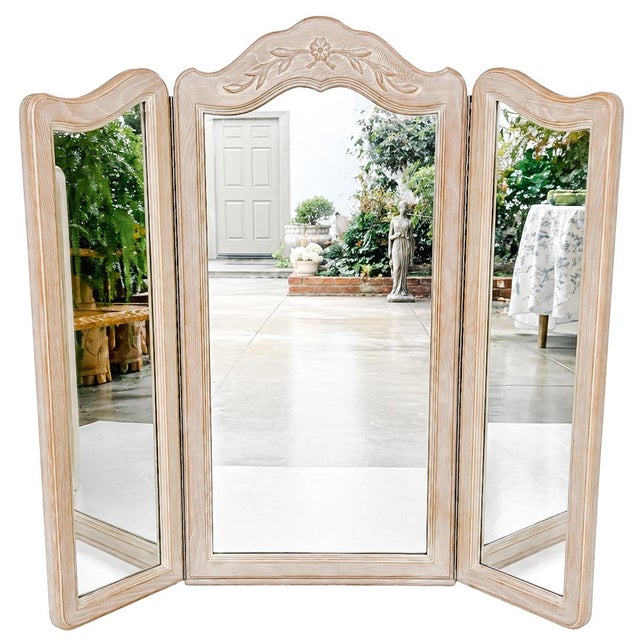 1970s vintage tri-fold mirror from the Drexel Cabernet Blanc collection. Featuring a graceful French Provincial...