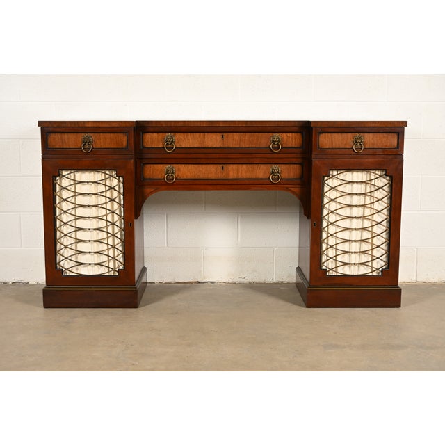 A beautiful English Regency or Georgian style sideboard, buffet, credenza, or bar cabinet By Kittinger USA, Circa 1960s...