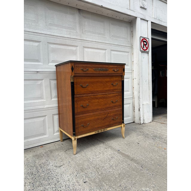 We have a beautiful, vintage Neoclassical Revival chest of drawers for sale. It features beautiful Louis XVI and Empire...