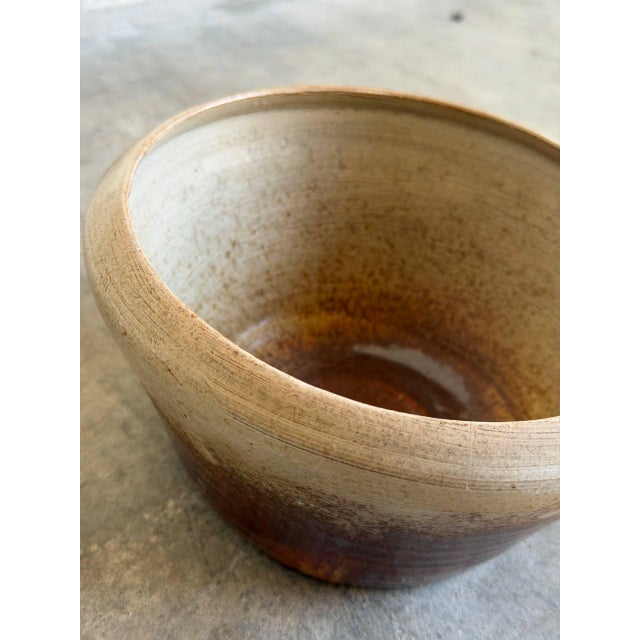 Vintage 1960s Mid-Century Modern studio ceramic bowl features a captivating two-tone ombré design with an organic,...