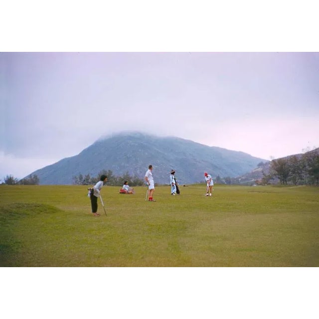 Four 1959 A group of golfers and caddies prepare for a shot, Hong Kong, 1959. Toni Frissell Antoinette Frissell Bacon...