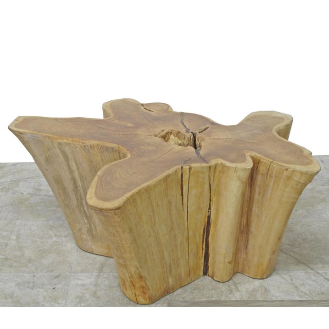 Inspired by the beauty of natural root form, this organic teak accent table is handcrafted from one piece of salvaged teak...